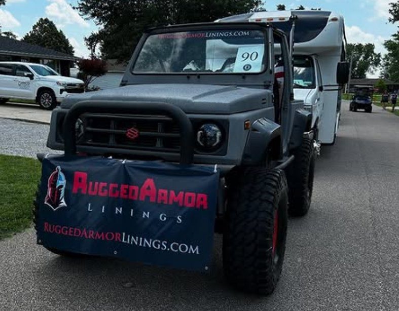 A 4x4 carrying the RuggedArmor Linings banner